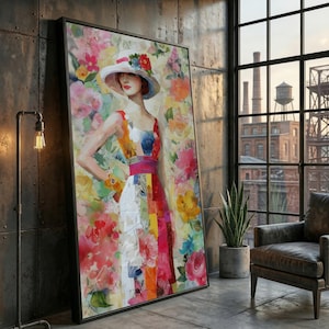 Könnte beinhalten: Großformatige gerahmte Kunstwerk mit einem Aquarellgemälde einer Frau in einem farbenfrohen Kleid und Hut, vor einem Hintergrund aus lebendigen Blumen. Das Kunstwerk wird in einem modernen Raum im Industriestil mit einem großen Fenster ausgestellt.