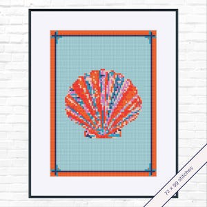 May include: A framed cross-stitch pattern featuring a colorful seashell design. The shell is rendered in shades of orange, pink, and blue against a light blue background. The frame is black with an orange border. The text "72 x 99 stitches" is visible.