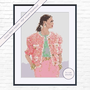 May include: Cross stitch pattern of a woman in a pink jacket and skirt. The image is framed in black with the text "Cross Stitch Pattern - PDF Instant Download" and "72 x 99 stitches". The woman is wearing a light green top and gold jewelry.