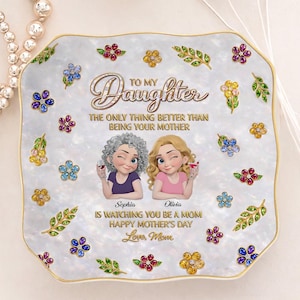 May include: A decorative, square-shaped plate with a pearlescent finish and a gold rim. The plate features the text "To My Daughter" and "Happy Mother's Day". It also includes illustrations of flowers and two women holding drinks.
