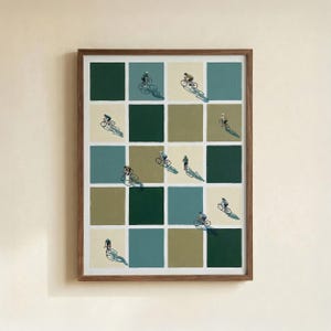 May include: Framed artwork depicting a grid of squares in shades of green, blue, and beige. Each square contains a small figure cycling, with long shadows. The artwork is encased in a brown wooden frame.