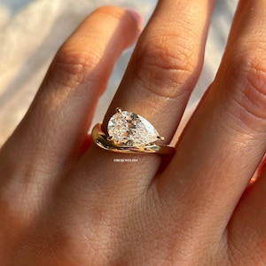 Offset Pear Diamond Engagement Ring in Yellow Gold
