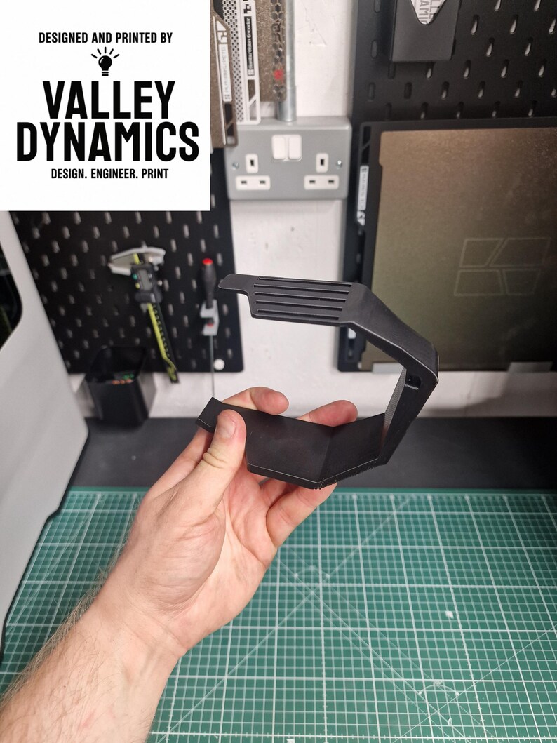 A custom design we created to hold a dust collection box on a milwauke mouse sander.