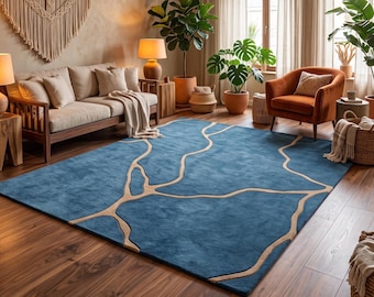 May include: A rectangular area rug featuring a deep blue base color with a contrasting light beige abstract pattern of interconnected, organic, flowing lines that span across the entire surface of the floor covering.