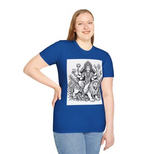 May include: A royal blue t-shirt with a black and white illustration of a deity riding a lion. The graphic is framed by floral elements. The shirt has a crew neck and short sleeves. The design is centered on the front.