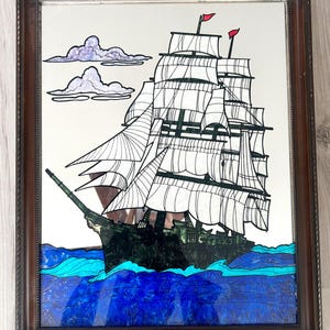 May include: A white ceramic mug with a black handle and the text "But first, coffee" in a black, handwritten-style font. The mug is on a white surface.