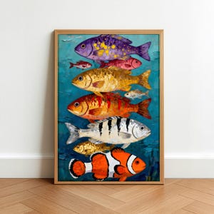 May include: A vertical oil painting in a light wood frame featuring a stack of various fish species against a deep blue background. The fish are rendered in thick, textured brushstrokes with vibrant colors including purple, gold, red, and orange.