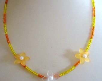 Orange and Yellow Glass Rocaille Necklace with Orange and White Plastic Flowers by JulieDeeleyJewellery on Etsy Orange Flower Necklace