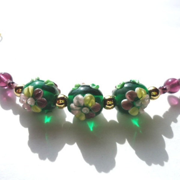 Bracelet Handmade Purple and Green Glass Lampwork Bead Flower by JulieDeeleyJewellery on Etsy