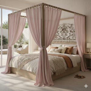 May include: A four-poster bed with light wood frame and soft pink curtains. The bed is made with white and beige bedding, decorative pillows, and a fringed throw blanket. A decorative metal headboard and a side table with a lamp are also visible.
