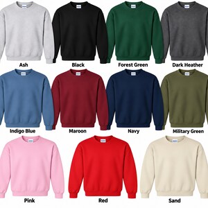 a collection of twelve different colored sweatshirts, each with a unique color and design.