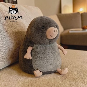 May include: A rustic wooden sign with the text "Welcome to our home" in white lettering. The sign has a distressed finish and a simple, inviting design, ideal for front door decor.