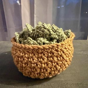 May include: A rustic wooden sign with the text "Welcome to our home" in white lettering. The sign features a distressed finish and a simple, inviting design, perfect for entryway decor.