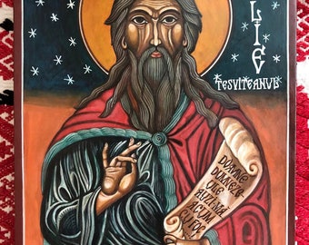 May include: A hand-painted icon of the prophet Elijah, also known as Elias, with a dark blue background and a gold halo. The icon features a scroll with the text "DOAMNE DUMNEZE-ULE AUZI-MA CU FOC" in Romanian.