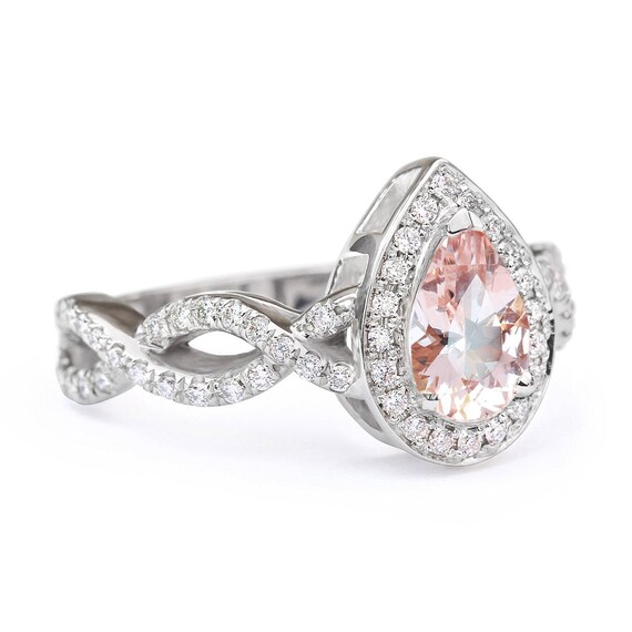 Pear shaped ring with clearance infinity band