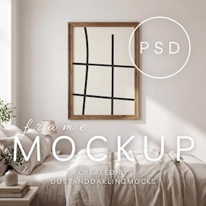 May include: A framed art mockup with a rectangular wooden frame. The artwork has a cream background with black lines. The image is on a white wall above a bed. The text "frame MOCKUP" is displayed in the image.