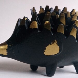 A complete set of six stacking metal hedgehog ashtrays by Walter Bosse