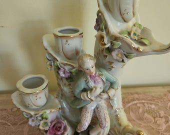 Vintage Porcelain candelabra with three candle holders with floral decoration