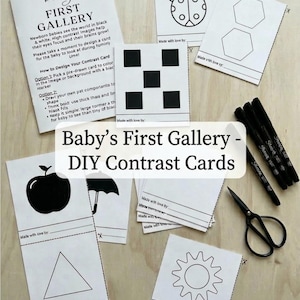 May include: A collection of DIY contrast cards for babies, featuring black and white designs. The set includes blank cards, markers, and scissors. Text on the cards reads "Baby's First Gallery - DIY Contrast Cards" and "34 High Contrast Images."