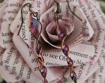 Anodized niobium or titanium earrings, looks like twisted glass, typically known to be hypoallergenic, ruby red colored