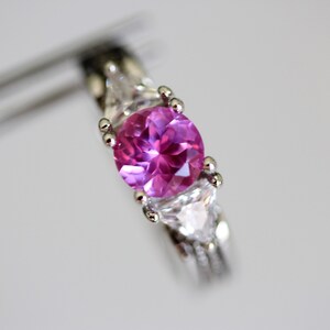 Lustrous Lab Created Pink Sapphire in an Accented Sterling Silver Setting