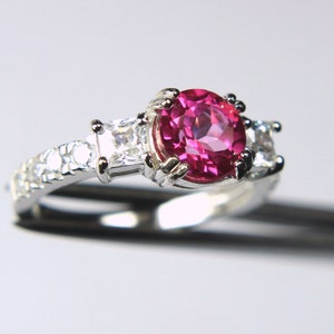 Beautiful Genuine Peony Topaz in a Glowing Accented Sterling Silver Setting
