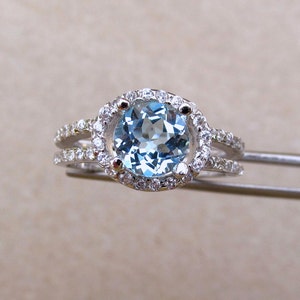 Brilliant Genuine  Sky Blue Topaz in a Glowing Accented Sterling Silver Setting