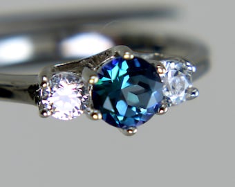 Neptune Garden Topaz Round in an Gleaming Accented Sterling Silver Ring