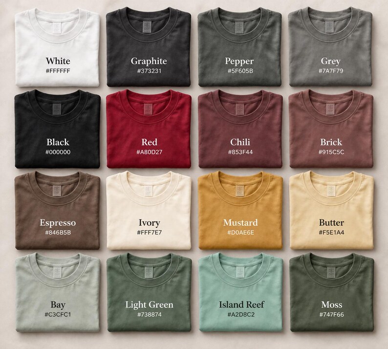 May include: Sixteen t-shirts in a range of colours, including white, black, and red. Each shirt is laid flat, with the colour name and hex code printed above. The colours vary from light to dark, with names such as "Graphite" and "Mustard".