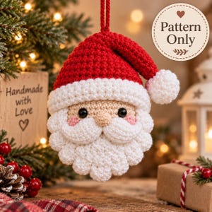 May include: A crocheted Santa Claus ornament featuring a red hat with a white pom-pom, a beige face with black eyes, pink cheeks, and a textured white beard. A circular tag in the upper right corner displays the text Pattern Only.