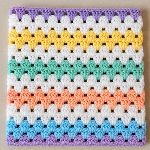 May include: A square crochet blanket featuring a repeating granny stitch pattern. The design consists of horizontal stripes in alternating colors of lavender, white, yellow, white, mint green, white, peach, white, light blue, and lavender.