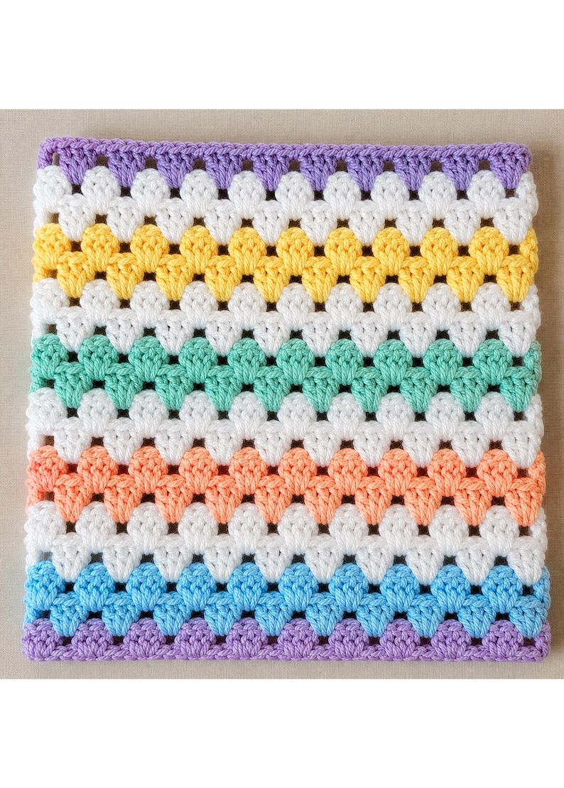 May include: A square crochet blanket featuring a repeating granny stitch pattern. The design consists of horizontal stripes in alternating colors of lavender, white, yellow, white, mint green, white, peach, white, light blue, and lavender.