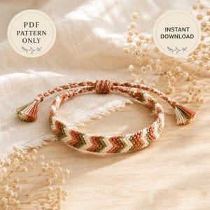 May include: A woven bracelet featuring a chevron pattern in shades of terracotta, sage green, and cream. The bracelet has braided ties ending in small tassels. Text on the image reads: PDF PATTERN ONLY and INSTANT DOWNLOAD.