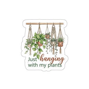 May include: A sticker featuring a watercolor illustration of hanging plants in macrame hangers. The plants are in terracotta pots and are suspended from a wooden rod. The text reads "Just hanging with my plants."
