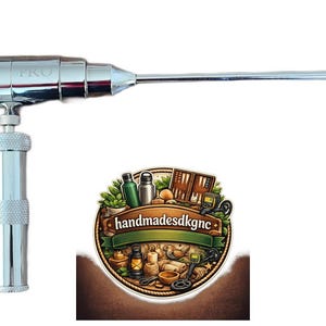 May include: A shiny metal tool with a long, pointed tip, labeled "MRV2 PRO." The tool has a cylindrical body and a handle. A circular logo with the text "handmadesdkgne" is at the bottom.