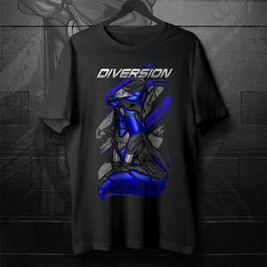 May include: Black t-shirt featuring a blue and black graphic of a futuristic motorcycle or robotic figure. The word "DIVERSION" is printed in white above the graphic. The design includes blue and gray brushstroke-like accents.
