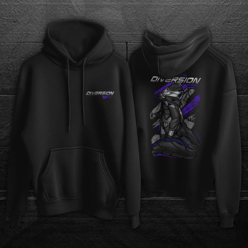 May include: Black hoodie with the word "DIVERSION" in white and purple on the front and back. The back of the hoodie features a graphic of a character in shades of gray and purple. The hoodie has a front pocket and a hood with a drawstring.