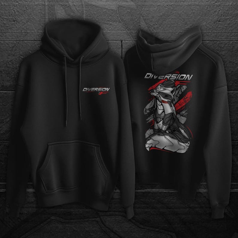 May include: Two black hoodies. The front of one hoodie has the word "DIVERSION" in white and red. The back of the other hoodie has a graphic of a robot-like figure with the word "DIVERSION" above it. The graphic has red accents.