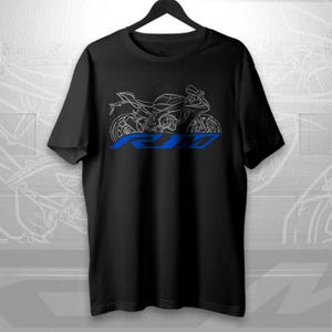 May include: Black t-shirt featuring a white outline of a motorcycle and the blue letters "RJM" below the motorcycle. The motorcycle design includes details of the engine, wheels, and body.