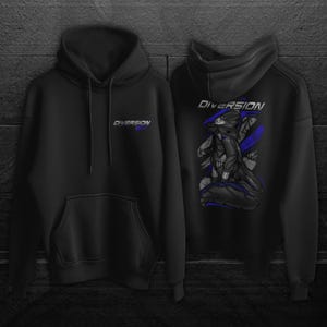May include: Black hoodie with the word "DIVERSION" in blue and white on the front and back. The back of the hoodie features a graphic of a futuristic figure with blue accents. The hoodie has a hood and a front pocket.