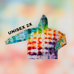 May include: A tie-dye hoodie in a 2X size, featuring a vibrant mix of colors including blue, green, yellow, orange, red, and purple. The hoodie has a hood and long sleeves. The text "UNISEX 2X" is printed on the upper left side.
