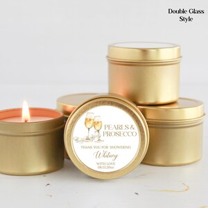 May include: Gold candle tins with a white label that says "Pearls & Prosecco" and "Thank you for showering Whitney with love 08.11.20XX".