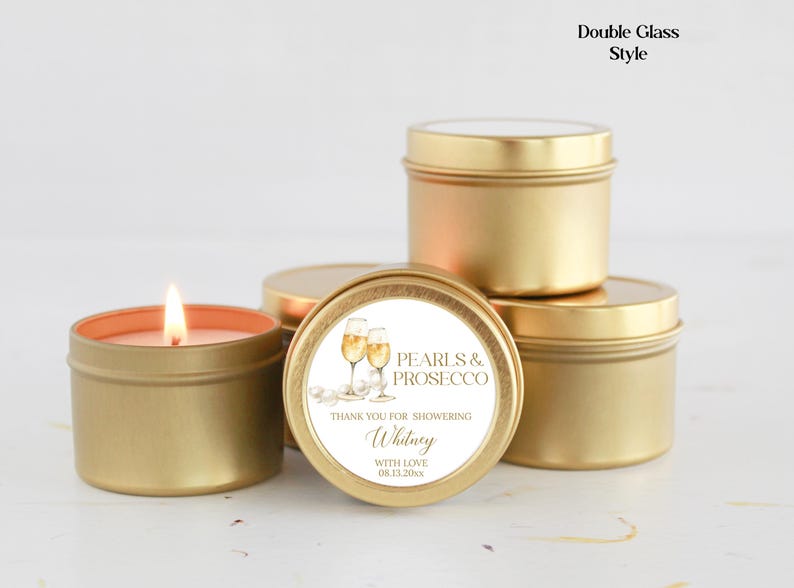 May include: Gold candle tins with a white label that says "Pearls & Prosecco" and "Thank you for showering Whitney with love 08.11.20XX".