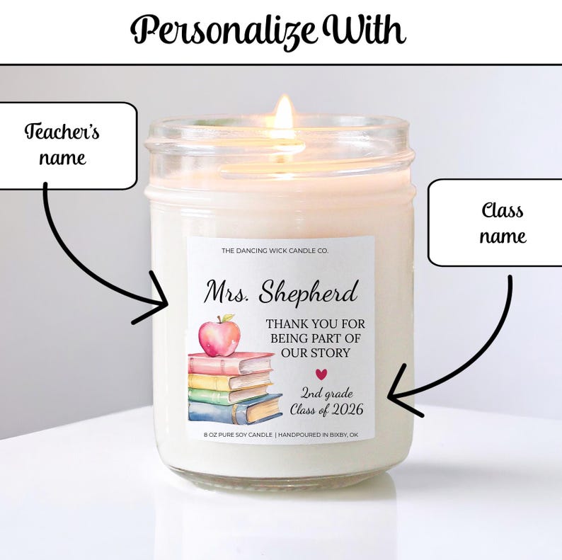 May include: A lit soy candle in a glass jar. The label reads "Mrs. Shepherd, THANK YOU FOR BEING PART OF OUR STORY, 2nd grade Class of 2026." An apple and books are illustrated on the label. The candle is hand-poured in Bixby, OK.