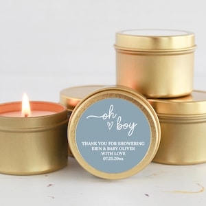 May include: Gold candle tins with a blue label that says "oh boy" with a heart and "Thank you for showering Erin & Baby Oliver with love 07.25.20xx"