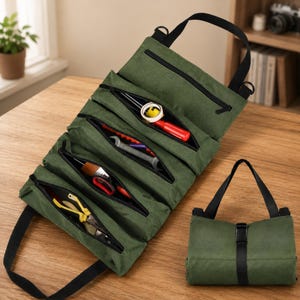 May include: An olive green canvas tool roll organizer featuring multiple zippered compartments containing various hand tools. The organizer includes a black carrying strap and a black buckle closure for secure storage when rolled up for transport.