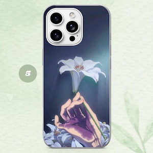 May include: A rectangular smartphone case featuring a printed illustration of a hand holding a white lily against a dark blue background. The design includes a small circle with the number 5 on the left side and a triple camera cutout at the top.