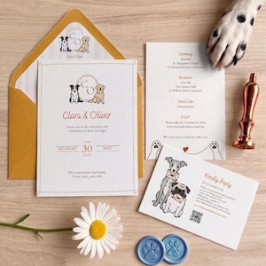 May include: A wedding invitation suite featuring illustrations of dogs, including a main invitation with the names Clara & Oliver, a ceremony card, and a reply card. The set includes a gold envelope, a copper wax seal stamp, and a white daisy flower.