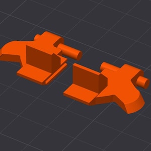 May include: Two orange, geometric shapes, possibly components of a larger structure, are displayed against a dark gray grid background. Each shape has a rectangular base and a cylindrical protrusion.