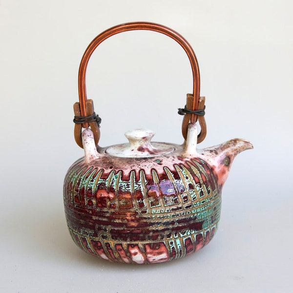 red green teal unique teapot with wooden handle